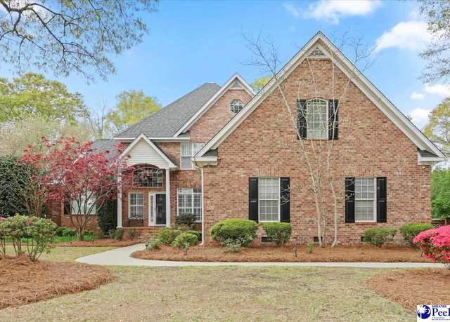 Classic brick house with a new shingle roof